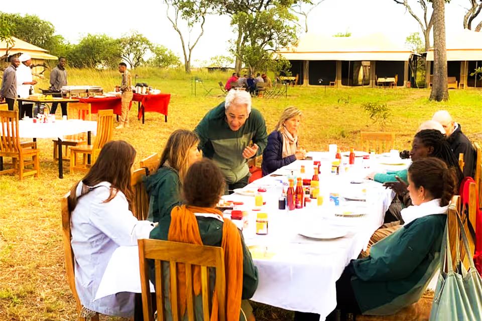 Breakfast laid out under an acacia